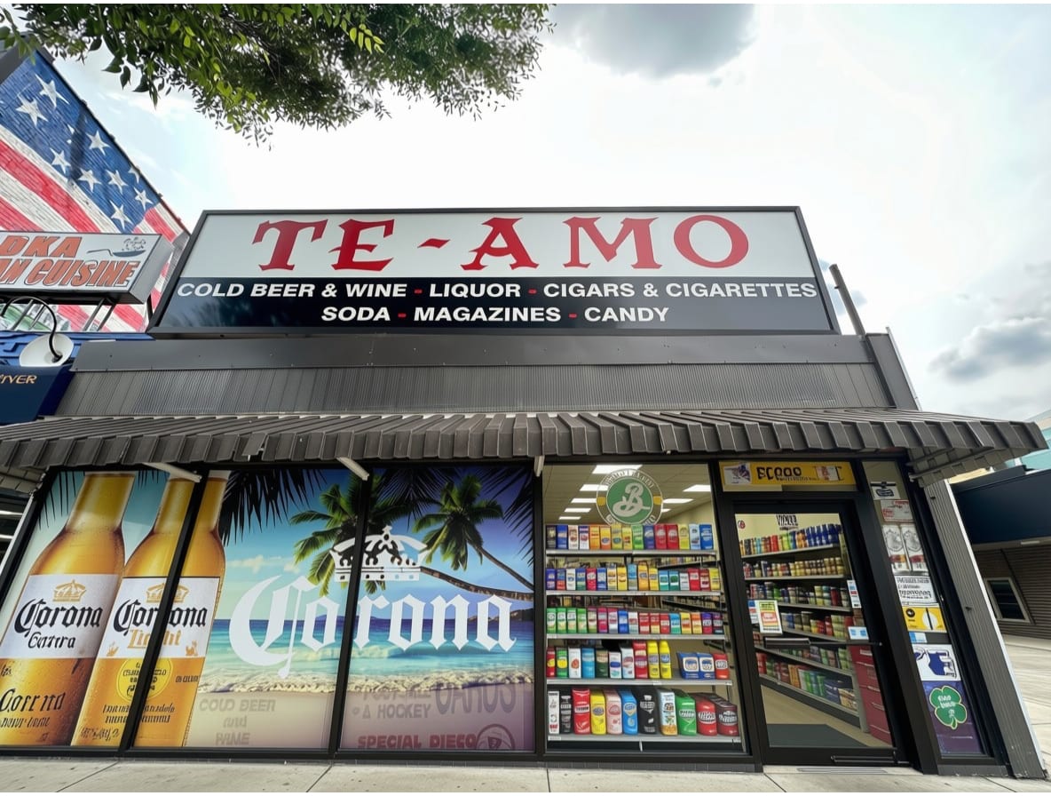 The Te-Amo storefront on Paterson Plank Road, its red serif sign reading Te-Amo above a black band listing cold beer and wine, liquor, cigars and cigarettes, soda, magazines and candy.